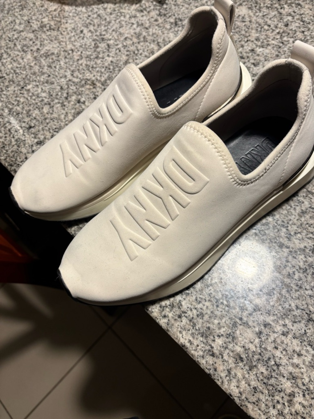 DKNY women’s Slip-On Sneakers in Off-White